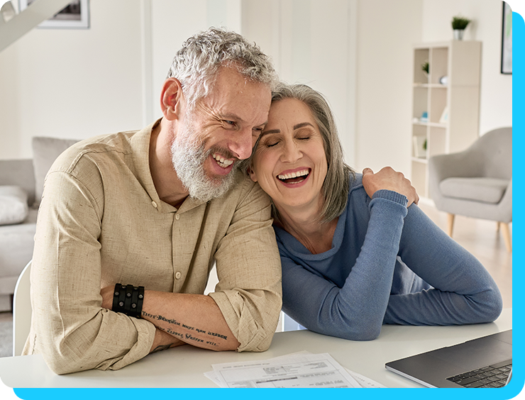 Image of older couple smiling at each other