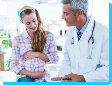 Physician talking with pregnant patient