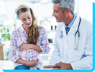 Physician talking with pregnant patient Physician talking with pregnant patient